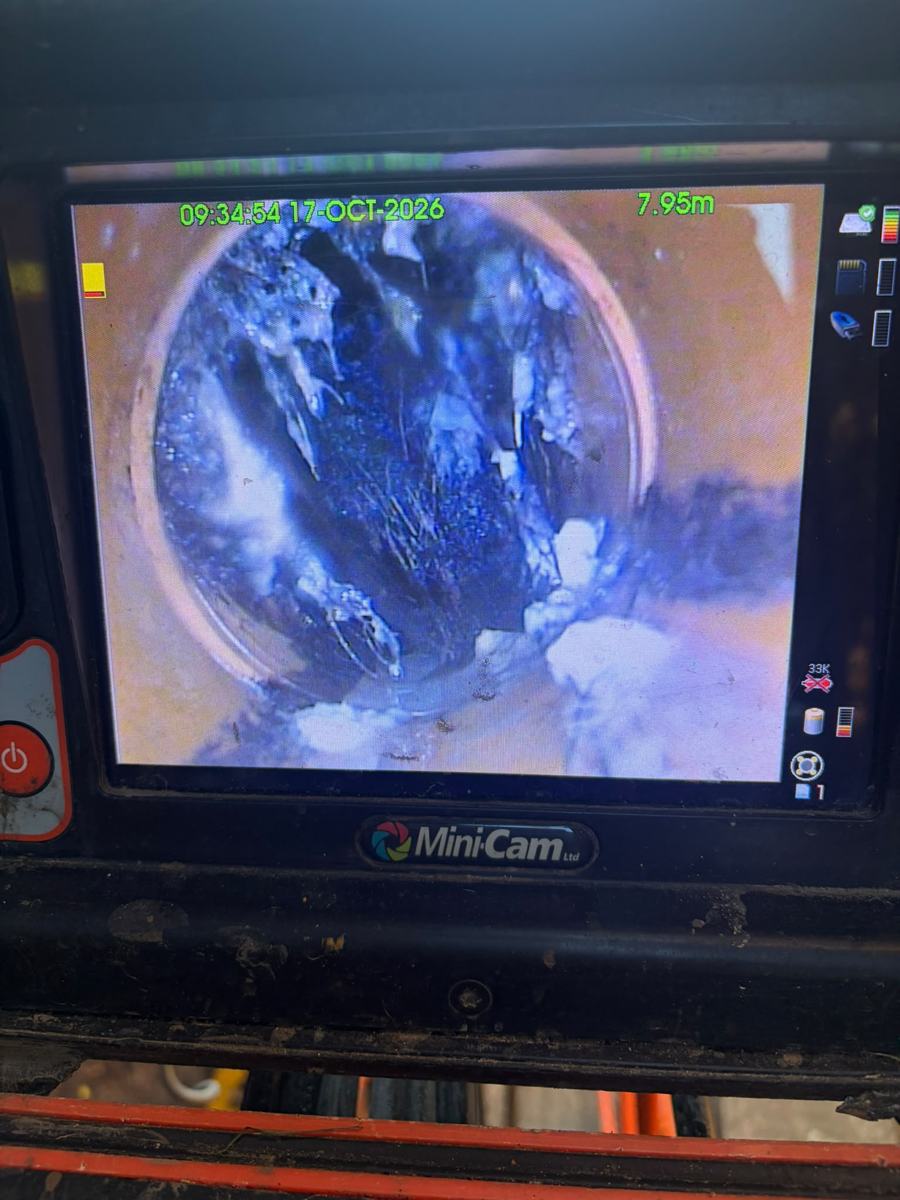 Drain camera monitor showing the inside of a pipe